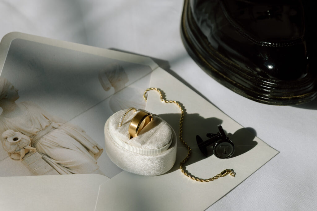 detail photo of bride and groom ring. groom incorporation traditional custom cufflinks