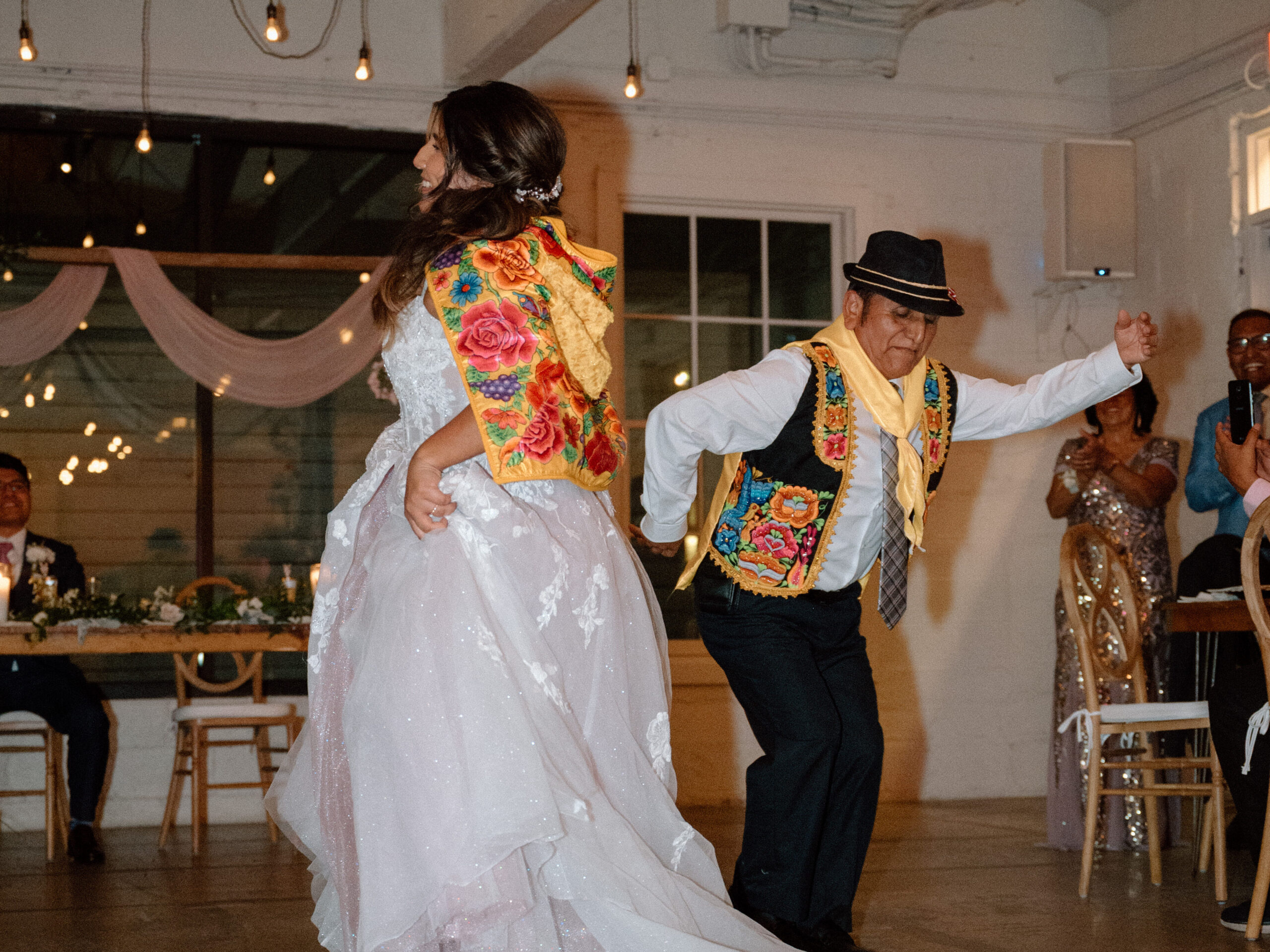 bride and father of the bride dancing a traditional Peruvian folkdance. incorporating traditional wedding dances